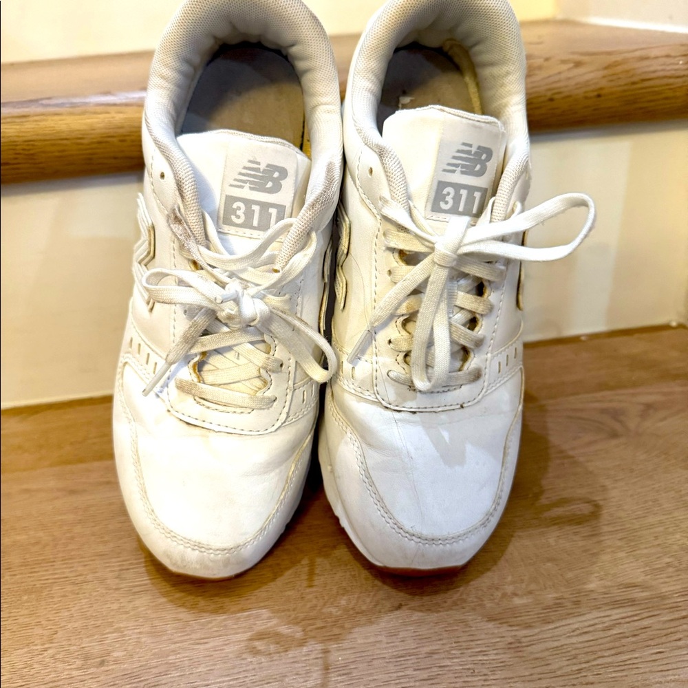 New Balance 311. White leather. Great for nursing school!
